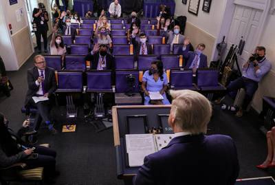 US President Donald Trump listens to a question from ABC News reporter Jonathan Karl as he holds a Covid-19 response news briefing at the White House in Washington, DC, USA. Reuters