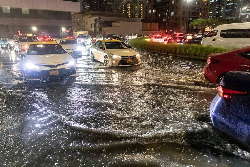 Cars drive through the rain in Dubai. Antonie Robertson / The National



