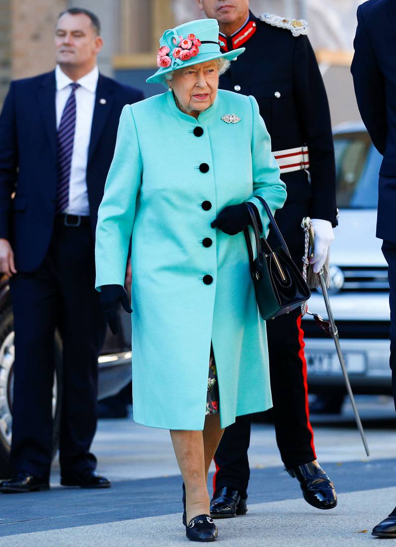 Queen Elizabeth II, wearing turquoise, visits The Lexicon shopping centre during a visit to Bracknell, England, on October 19, 2018. Getty Images