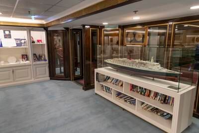 The exhibition includes a model of the QE2, artwork and several books about the vessel 