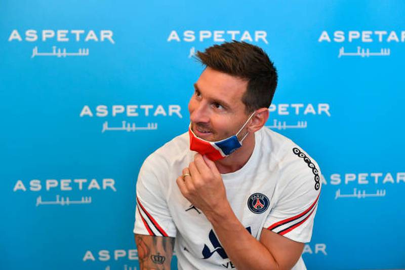Lionel Messi poses before his medical tests ahead of signing for Paris Saint-Germain.
