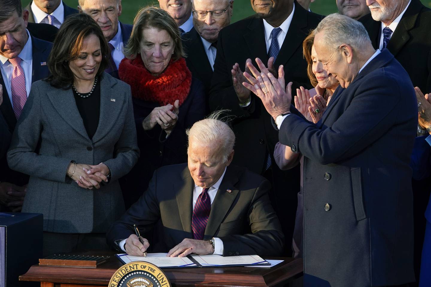 President Joe Biden signs the $1.2 trillion bipartisan infrastructure bill into law on the South Lawn of the White House in 2021. AP