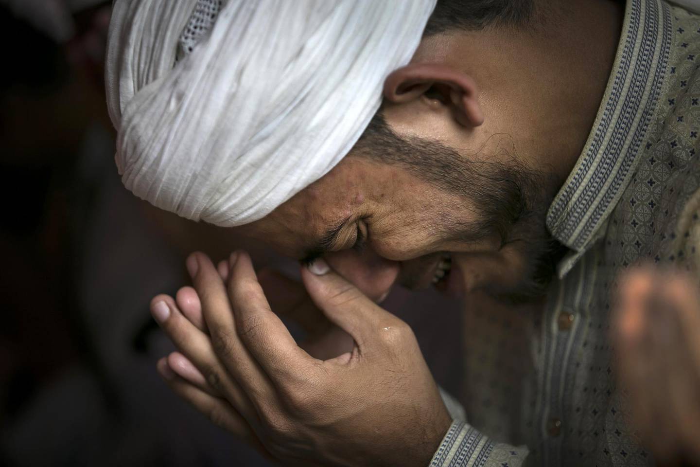 COX'S BAZAR, BANGLADESH - JANUARY 23: A man cries during a special prayer for a good outcome at the ICJ hearing at a mosque in a Rohingya refugee camp on January 23, 2020 in Cox's Bazar, Bangladesh. On Thursday, the International Court of Justice ordered Myanmar to take emergency measures to prevent genocide of the Rohingya. In a unanimously-ruled order  the court upheld the provisions of the 1948 Genocide Convention - saying Myanmar had "caused irreparable damage to the rights of the Rohingya". (Photo by Allison Joyce/Getty Images)