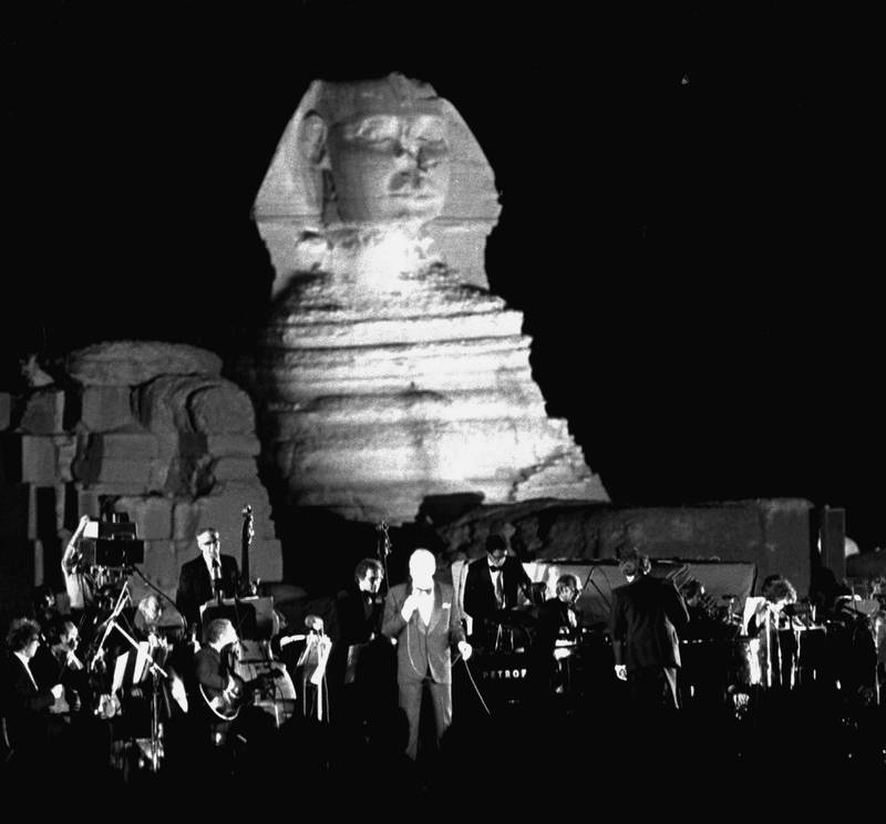 American singer Frank Sinatra is seen during his concert performance in front of the Sphinx in Giza Thursday night, September 27, 1979, in Cairo, Egypt.  Sinatra was invited to perform at the benefit concert for the Wafa Amal rehabilitation center for handicapped children by Egypt's First Lady, Jihan Sadat. (AP Photo/Bill Foley)