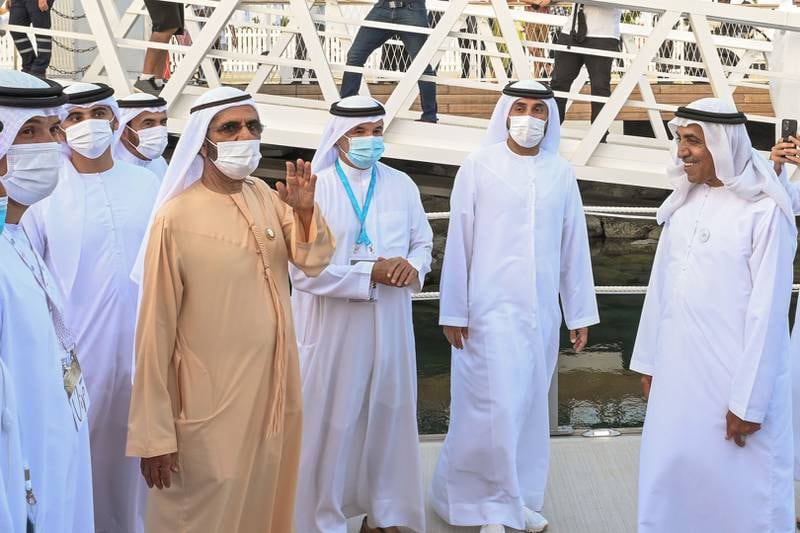 Sheikh Mohammed bin Rashid, Vice President and Ruler of Dubai, waves to visitors at the Dubai International Boat Show.