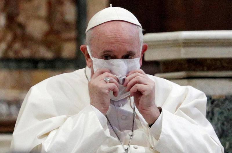 FILE PHOTO: Pope Francis wearing a face mask attends an inter-religious prayer service for peace along with other religious representatives in the Basilica of Santa Maria in Aracoeli, a church on top of Rome's Capitoline Hill, in Rome, Italy, Oct. 20, 2020. REUTERS/Guglielmo Mangiapane/File Photo