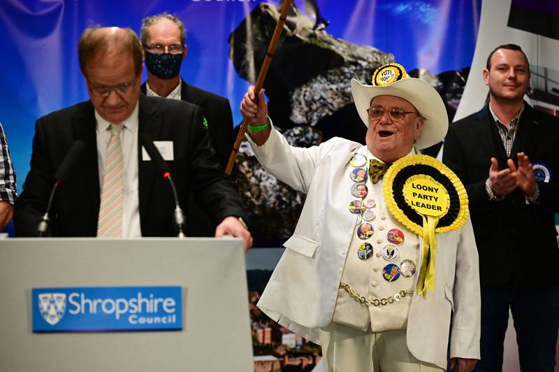 Howling Laud Hope of the Official Monster Raving Loony Party salutes his supporters as his result is announced. AFP