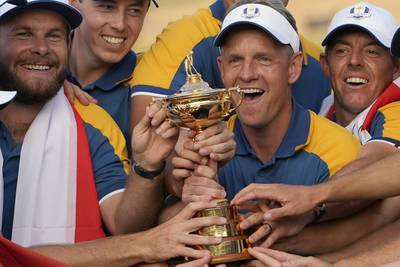 Europe's captain Luke Donald, centre, and team members lift the Ryder Cup. AP