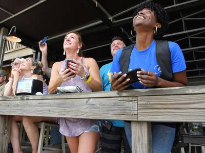 Spectators at Shiloh's Steak &amp; Seafood restaurant in Titusville, Fla. watching the launch of the SpaceX rocket.  AP