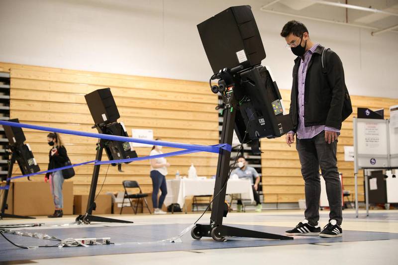 Julian Belilty, from the Kalorama neighbourhood of the District of Columbia, casts his early vote at the Marie Reed Elementary School in the Adams Morgan Neighborhood in Washington, U.S..  Reuters