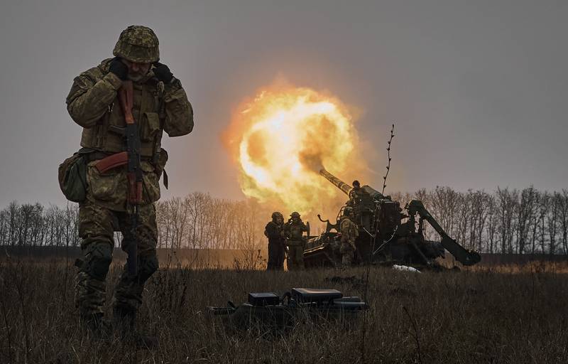 Ukrainian soldiers fire an artillery piece at Russian positions near Bakhmut, Donetsk region, Ukraine. AP