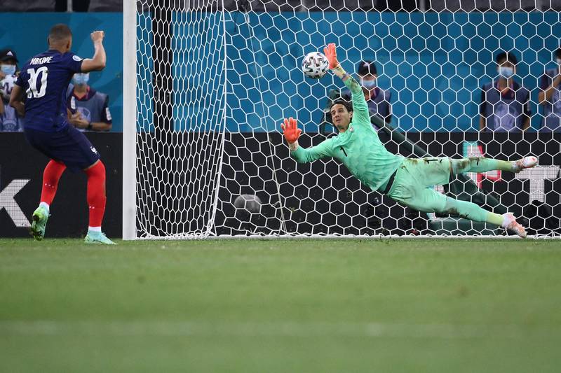 Switzerland's goalkeeper Yann Sommer saves Mbappe's spot kick. AFP