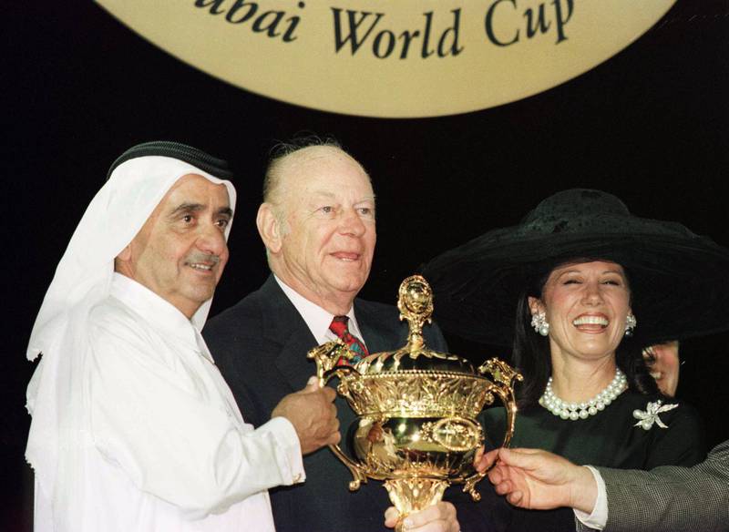 Allen Paulson, owner of Horse of the Year Cigar, is presented with the Dubai World Cup trophy in 1996 by Sheikh Maktoum bin Rashid, then ruler of Dubai. Getty Images