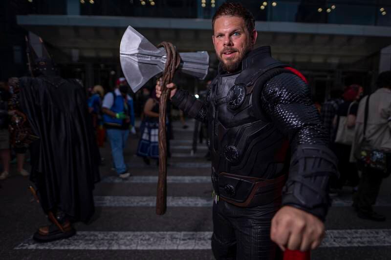 An attendee dressed as Thor poses during New York Comic Con. Charles Sykes / Invision / AP