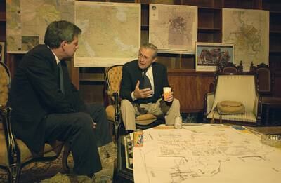 Presidential Envoy Paul Bremer, left, briefs Donald H. Rumsfeld, US Secretary of Defence, in Iraq, in 2003. Department of Defence