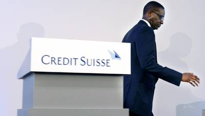 FILE -- In this Oct. 21, 2015 file photo Tidjane Thiam, CEO of Swiss bank Credit Suisse, leaves the podium during a press conference in Zurich, Switzerland. Credit Suisse CEO Tidjane Thiam hinted at a wave of job cuts at the Swiss bank, after unveiling disappointing third-quarter profits and informs about various measures to slash spiralling costs. Credit Suisse said Chief Executive Officer Thiam is resigning. Thiam will be replaced by Thomas Gottstein, a 20-year veteran of the bank who leads the Swiss unit. (Walter Bieri/Keystone via AP)