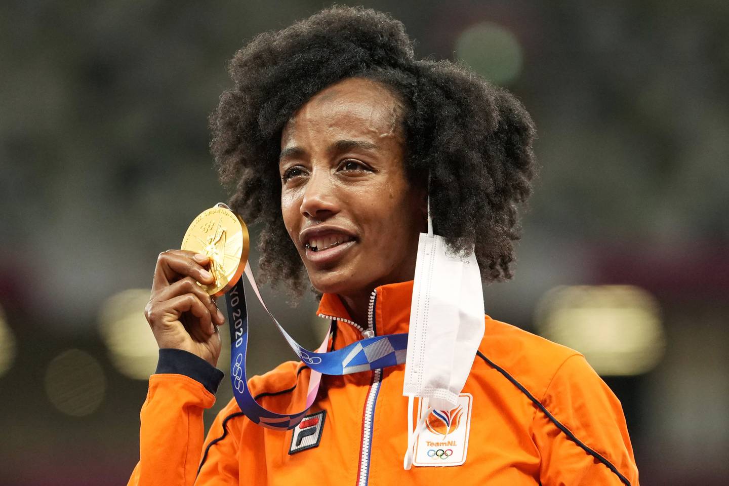 Hassan was flagbearer at the Tokyo Olympics' closing ceremony for the Netherlands, the country where she arrived 13 years ago as a refugee. AP Photo