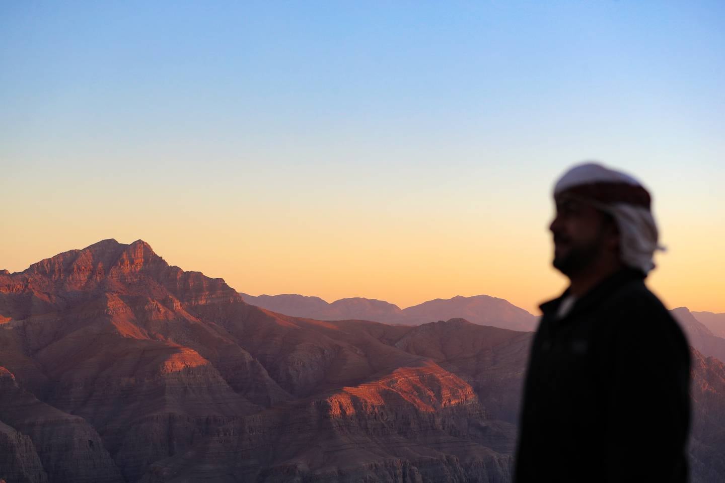 A sunset seen from the mountains in Ras Al Khaimah, UAE. Chris Whiteoak / The National