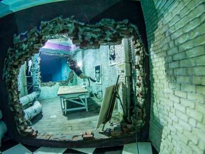 Other features include two underwater habitats with a dry chamber, 56 underwater cameras covering all angles of the pool, and an underwater sound and mood lighting system