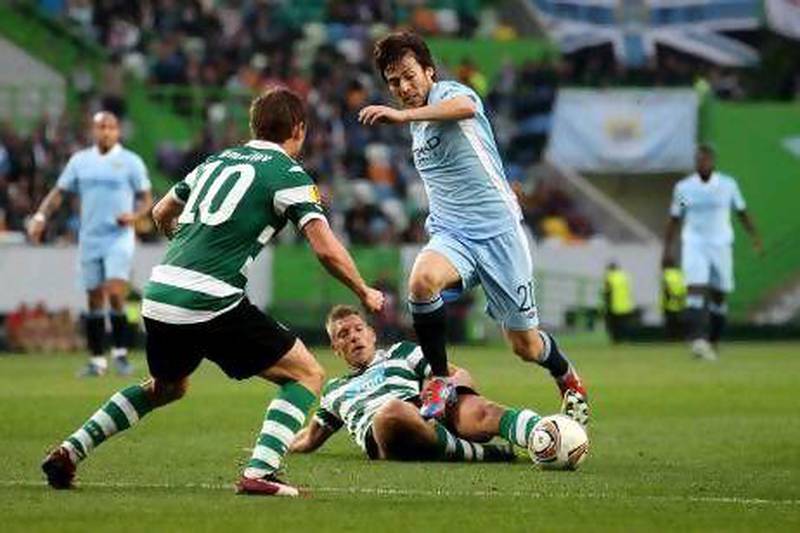 David Silva of Manchester City is tackled by Sporting Lisbon's Stijn Schaars last night. Scott Heavey / Getty Images