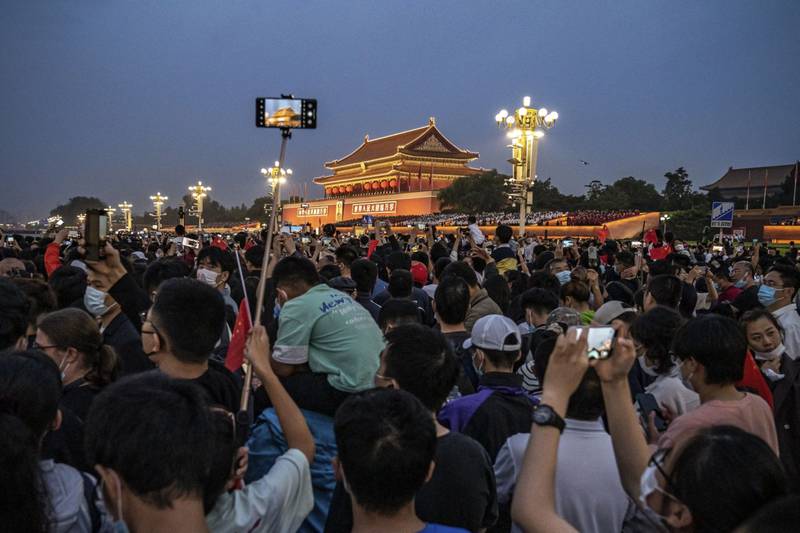 Members of the public at the flag raising ceremony in Tiananmen Square for China's 73rd National Day in Beijing. Bloomberg