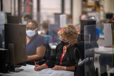 Poll workers tabulate ballots inside the Maricopa County Elections Department during the 2020 Presidential election in Phoenix, Arizona. Bloomberg