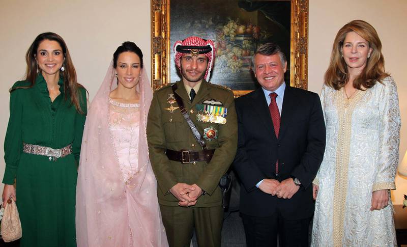 Jordan's King Abdullah; Queen Noor, widow of late King Hussein; and Queen Rania posing for a picture with Prince Hamzah, half-brother of Jordan's King Abdullah and his new wife Princess Basma Otoum in 2012. AFP, HO