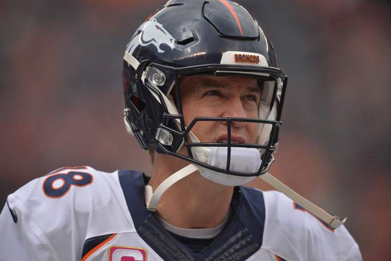  In this Oct. 18, 2015, file photo, Denver Broncos quarterback Peyton Manning stands on the sideline before an NFL football game against the Cleveland Browns in Cleveland. (AP Photo/David Richard, File)