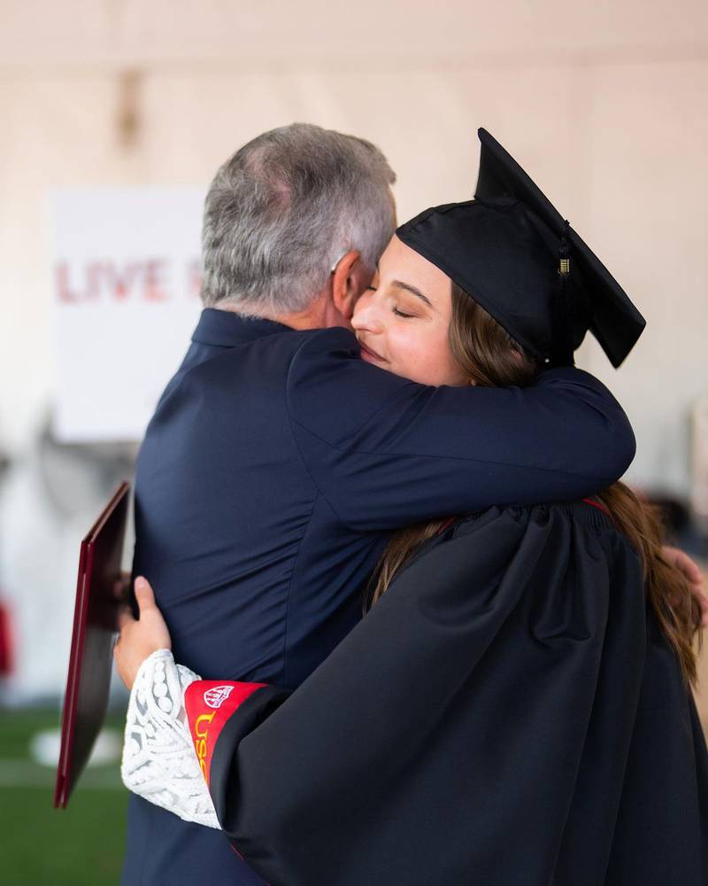 Princess Salma hugs her father, King Abdullah II, as she graduates from the University of Southern California. Photo: Queen Rania/Instagram