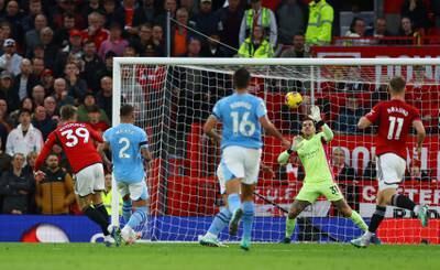 Manchester City's Ederson saves a shot from Manchester United's Scott McTominay. Reuters 
