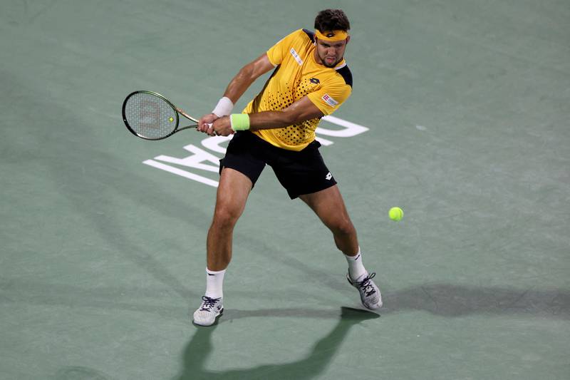 Jiri Vesely hits a backhand to Andrey Rublev during the Dubai Duty Free Tennis Championships final. AFP