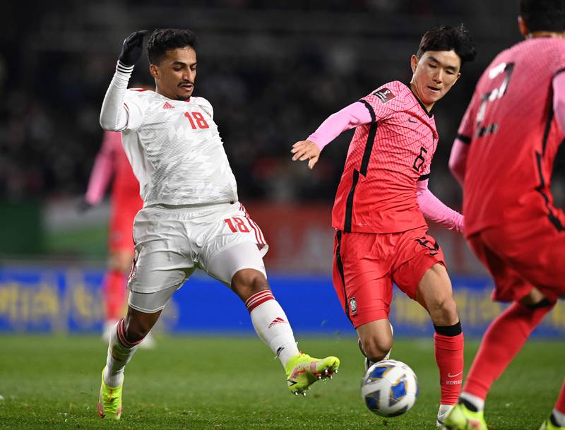 South Korea's Hwang In-beom, centre, and UAE's Abdullah Ramadan fight for the ball in Goyang. AFP