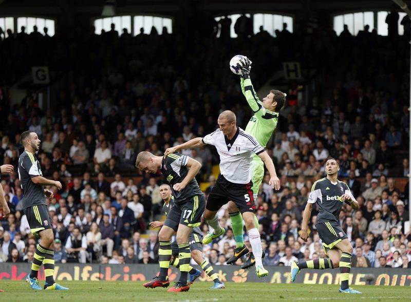 Stoke's keeper Asmir Begovic grabs the ball out of the air at Craven Cottage. Lefteris Pitarakis / AFP