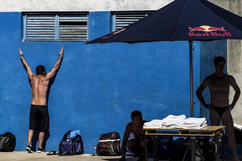 Image provided by Red Bull, Steven LoBue (L) of the USA warms up alongside Miguel Garcia Celis of Colombia and Andy Jones (R) of the USA during a training session at Inder pool in preparation for the first stop of the Red Bull Cliff Diving World Series in Havana, Cuba. Dean Treml / Red Bull via Getty Images