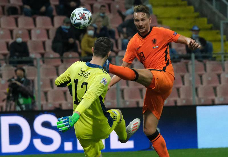 Bosnia goalkeeper Ibrahim Sehic under pressure from Netherlands' Luuk de Jong at the Stadion Bilino Polje. AP