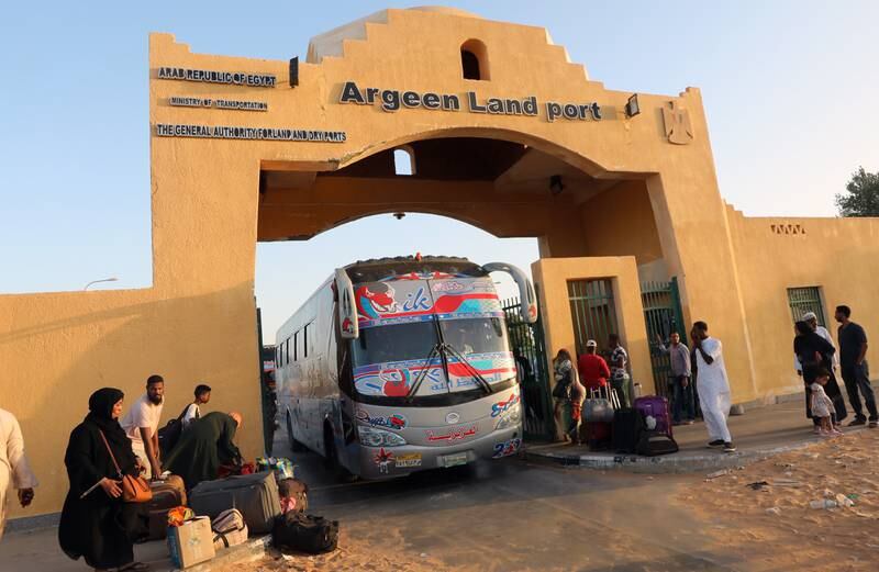 Passengers fleeing from Sudan reach Argeen, Egypt. EPA