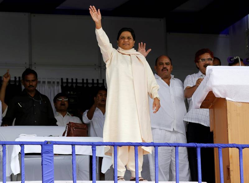 The Bahujan Samaj Party (BSP) chief Mayawati waves to her supporters during an election campaign rally on the occasion of the death anniversary of Kanshi Ram, founder of BSP, in Lucknow, India, October 9, 2016. Picture taken October 9, 2016. To match Insight INDIA-POLITICS/MAYAWATI    REUTERS/Pawan Kumar