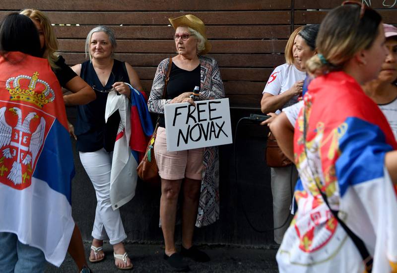 Members of the local Serbian community outside a hotel where Novak Djokovic is reported to be staying in Melbourne. AFP