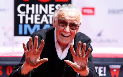 Marvel Comics co-creator Stan Lee shows his hands after placing them in cement during a ceremony in the forecourt of the TCL Chinese theatre in Los Angeles, California, U.S., July 18, 2017.   REUTERS/Mario Anzuoni     TPX IMAGES OF THE DAY