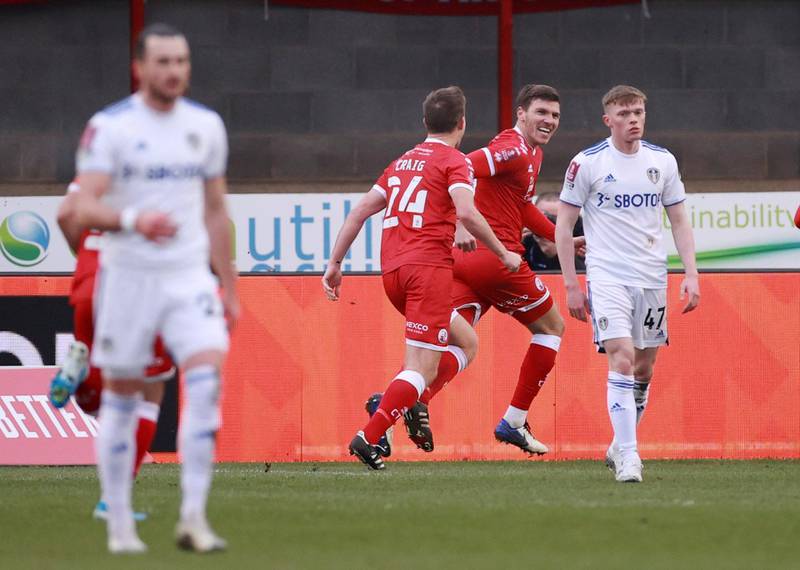 Soccer Football - FA Cup - Third Round - Crawley Town v Leeds United - The People's Pension Stadium, Crawley, Britain - January 10, 2021 Crawley Town's Jordan Tunnicliffe celebrates scoring their third goal with teammates REUTERS/Hannah Mckay