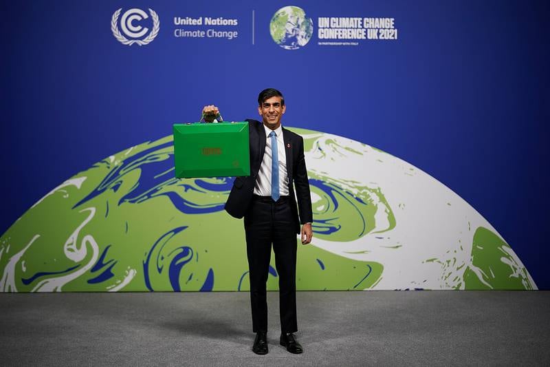 Mr Sunak arrives with his green budget box to deliver a keynote speech at the Cop26 summit in Glasgow, Scotland,  in November 2021. Getty Images