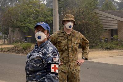 ADF personnel wear masks while working in Mallacoota. Getty Images