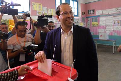 Tunisian Prime Minister Youssef Chahed casts his ballot for presidential election at a polling station in La Marsa on the outskirts of the capital Tunis. Rarely has the outcome of an election been so uncertain in Tunisia, the cradle and partial success story of the Arab Spring, as some seven million voters head to the polls today to choose from a crowded field.  AFP