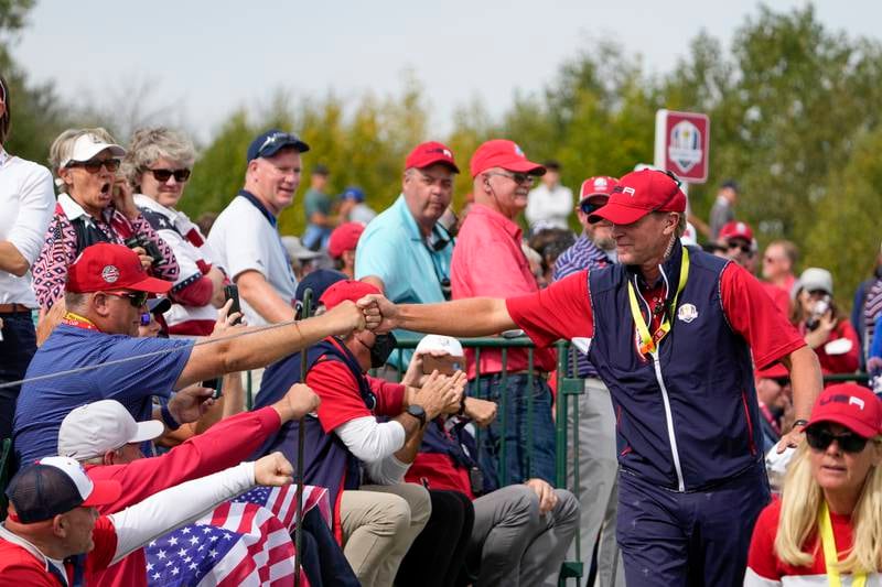 US captain Steve Stricker greets fans on the second hole during the Ryder Cup. AP