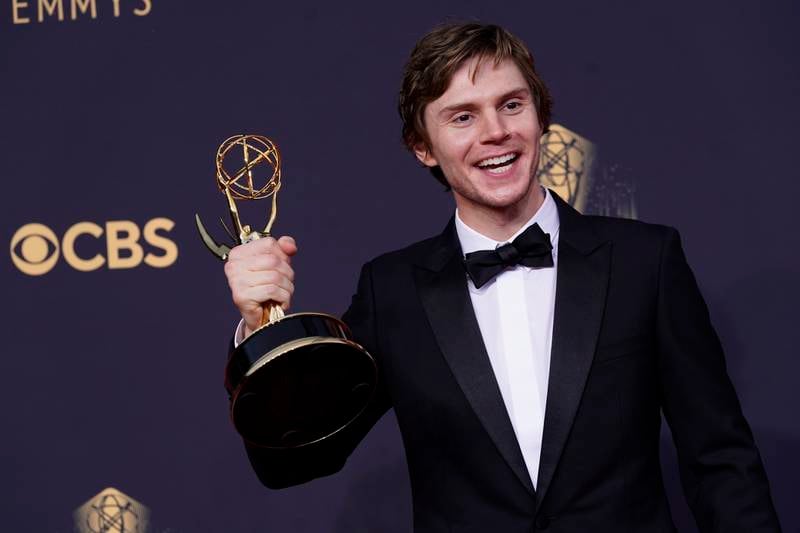 Evan Peters poses for a photo with the award for Outstanding Supporting Actor in a Limited or Anthology Series or Movie for 'Mare of Easttown. AP
