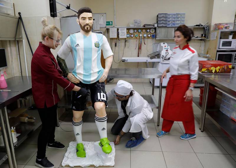 Employees of Altufyevo Confectionery finishes the preparation of a life-size chocolate sculpture of Lionel Messi. Reuters
