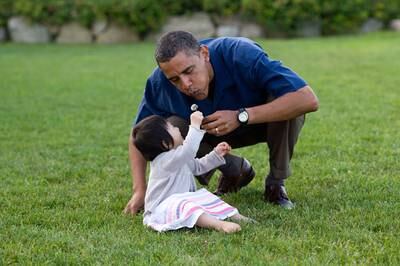 On vacation in Martha’s Vineyard, Mr Obama shares a moment with his young niece, Savita. Photo: The National Archives