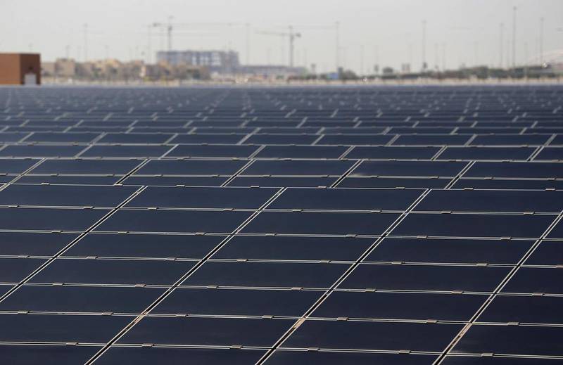 The UAE shattered world records for the lowest price for solar power with a bid of 5.84 cents per kilowatt hour for the second phase of Mohammed bin Rashid Al Maktoum solar park. Rates are likely to drop further this year. Karim Sahib / AFP