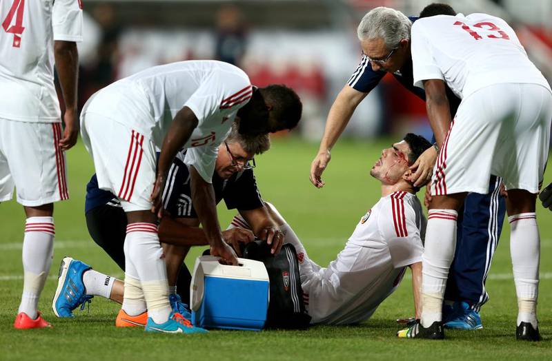 Mohnad Salem Ghazy Al Amin of the U.A.E. receives medical treatment during the international friendly between the UAE and Australia at Mohamed Bin Zayed Stadium on October 10, 2014 in Abu Dhabi, United Arab Emirates. Warren Little/Getty Images