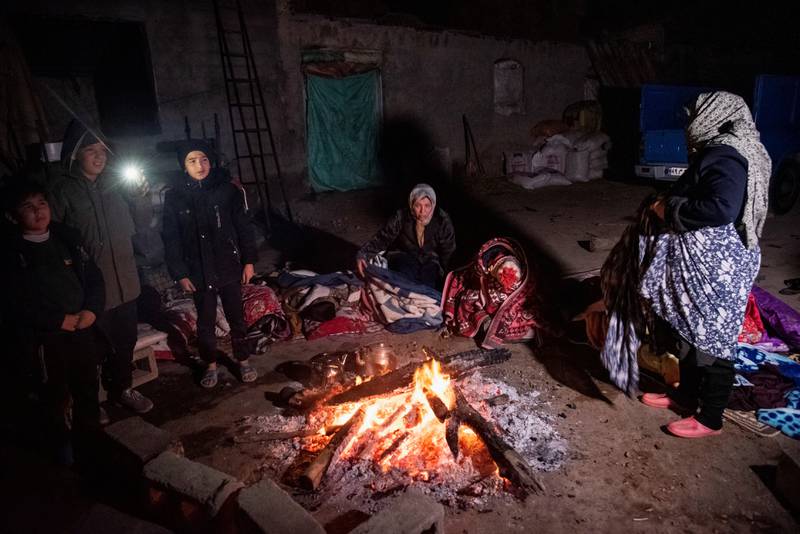 People gather near a fire after the earthquake. Reuters 